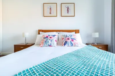 a bedroom with a bed with two pillows on it at Centromar Residence Ocean View By Atlantic Holiday in Funchal