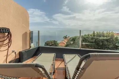 a balcony with a view of the ocean at Costa Apartment - Vista Mar in Caniço