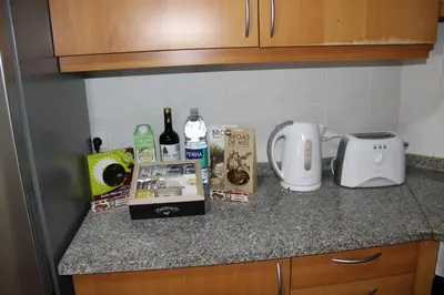 a kitchen counter with a toaster and other items on it at CRISTO REI APARTMENT in Caniço