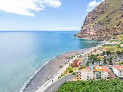 an aerial view of a beach with a mountain at Magical Sunset in Madalena do Mar