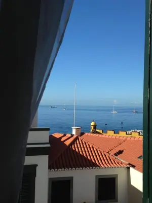 a view of the ocean from the roof of a building at Vitorina Corte Guesthouse in Funchal