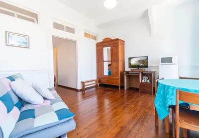 a living room with a couch and a table at Vitorina Corte Guesthouse in Funchal
