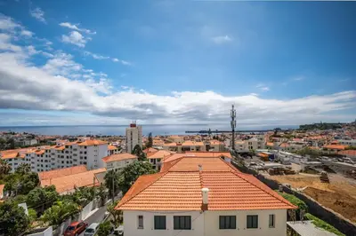 an aerial view of a city with a building at Rooftop Funchal - By Wehost in Funchal