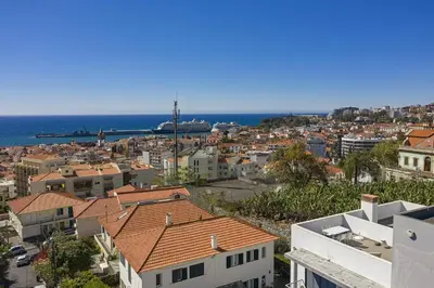 an aerial view of a city with the ocean at Rooftop Funchal - By Wehost in Funchal