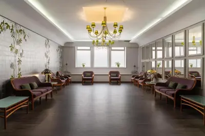 an empty room with a dance floor and windows at Hotel Madeira in Funchal