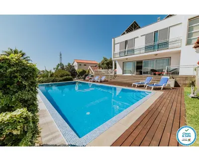 a swimming pool in the backyard of a house at Villa Sol by Amazing Madeira in Ponta do Sol