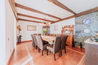 a dining room with a table and chairs at Villa Sol by Amazing Madeira in Ponta do Sol