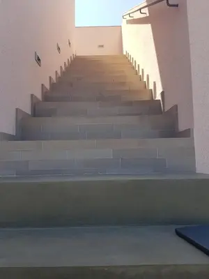a stairway in a building with blue steps at Casa Atlantico Dachterrassengeschoss in Ribeira Brava