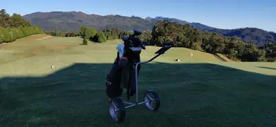 a person is riding a tricycle on a golf course at Casa Atlantico Dachterrassengeschoss in Ribeira Brava