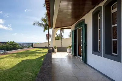 a porch of a house with a view of the ocean at Gem of a House by Homie in Funchal