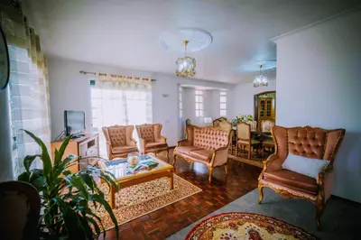 a living room with chairs and a coffee table at Gem of a House by Homie in Funchal