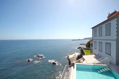 a view of the ocean from a building at Luxury Barreirinha House old town by Holiday Rental Madeira in Funchal