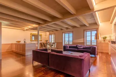 a living room with a couch and a table at Luxury Barreirinha House old town by Holiday Rental Madeira in Funchal