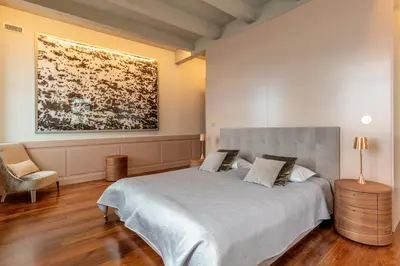 a bedroom with a bed and a painting on the wall at Luxury Barreirinha House old town by Holiday Rental Madeira in Funchal