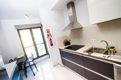 a kitchen with a sink and a counter at Madeira Luxury Villas Living Funchal in Funchal