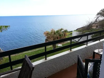 a view of the ocean from a balcony at Chuva De Prata in Caniço