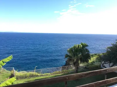 a view of the ocean from a balcony at Chuva De Prata in Caniço