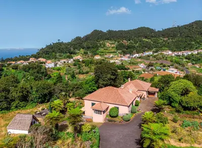 an aerial view of a house with the ocean in the background at Casa da Tia Clementina in Santana