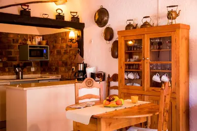 a kitchen with a table with fruit on it at Casa da Montanha in Luz