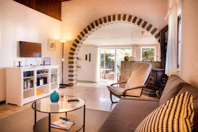 a living room with a couch and a table at Casa da Montanha in Luz
