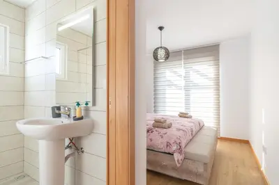 a bathroom with a sink and a mirror at Casa Leonardo in Arco da Calheta