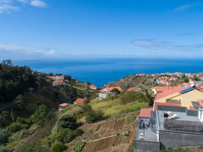 a view of the ocean from a hill at Casa Leonardo in Arco da Calheta