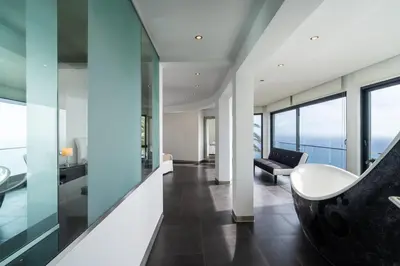 a living room with a couch and a chair in a building at Zula House - Stunning villa spectacular location in Caniço
