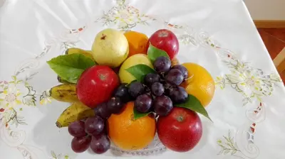 a bowl of fruit sitting on a table at Lindo Apartamento Villa in Ponta do Sol