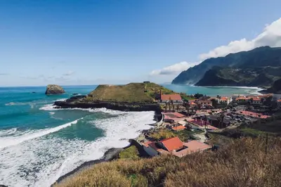 an aerial view of a small town on the beach at Hotel Vila Bela in Porto da Cruz