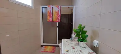 a bathroom with a shower with a toilet and a plant at Appartamento Villa in Ponta do Sol