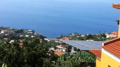 a view of the ocean from a city at Appartamento Villa in Ponta do Sol