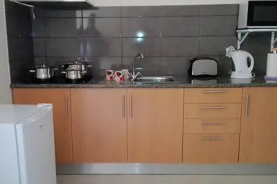 a kitchen with a sink and a counter top at Apartamento Villa in Ponta do Sol