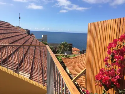 a view of the ocean from the balcony of a house at Casa da Cal - by Casas na Ilha in Câmara de Lobos