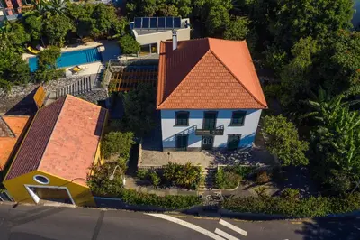 an overhead view of a white house with an orange roof at Casa da Cal - by Casas na Ilha in Câmara de Lobos
