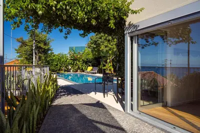 a view of a swimming pool from a house at Casa da Cal - by Casas na Ilha in Câmara de Lobos