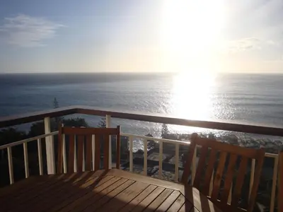 a view of the ocean from the balcony of a house at Listen the sound of the Sea - The Sunset of your Dreams in Funchal