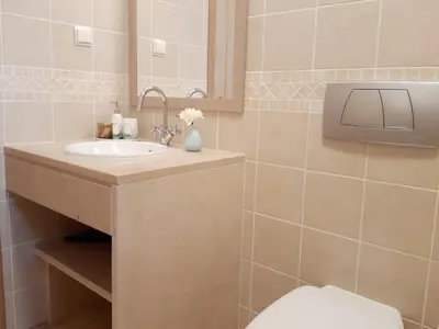 a bathroom with a sink and a toilet at Casa Canavial in Luz