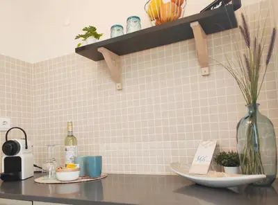 a kitchen with a counter with a vase on it at Casa Canavial in Luz