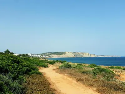 a dirt road leading down to a beach at Casa Canavial in Luz
