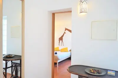 a room with a giraffe on the wall at Private Villa Rego with Oceanview and Pool in Luz
