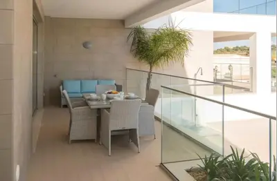 a dining room with a table and chairs at ZENTUNI Ocean front in Lagos