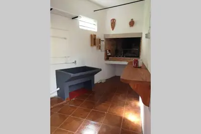 a kitchen with a blue sink in a room at VillaHouse in São Vicente