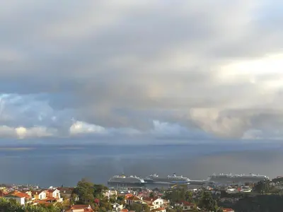a view of a city with ships in the water at Casa do Imaculado in Funchal