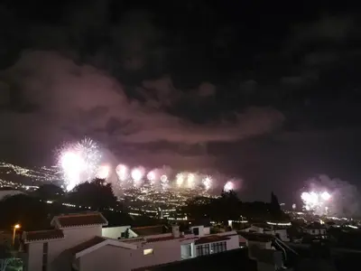 a fireworks display over a city at night at Casa do Imaculado in Funchal
