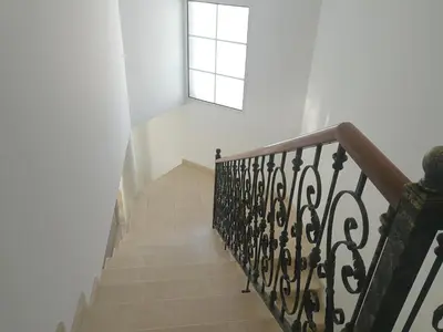 a stairway with a window and a stair case at Casa Vanday in Funchal