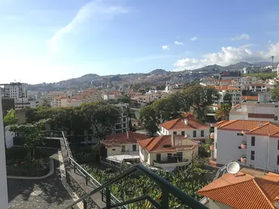 a view of a city from a balcony at Casa Vanday in Funchal