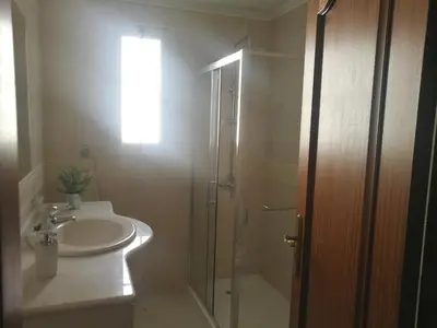 a bathroom with a sink and a shower and a sink at Casa Vanday in Funchal