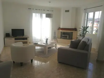 a living room with a couch and chairs and a table at Casa Vanday in Funchal