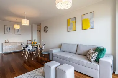 a living room with a couch and a table at Centromar Bella Vista by Atlantic Holiday in Funchal