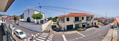 a city street with cars parked on the road at CASA Da CERCA ACHADA De GAULA in Santa Cruz